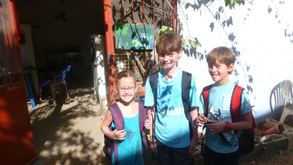 The three Sampson kids with their backpacks on their first day of school at TIDE Academy in Tamarindo, 2012